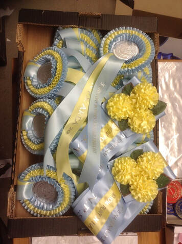 Flower rosette with printed ribbons